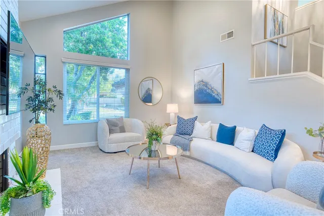 a living room with furniture and a table