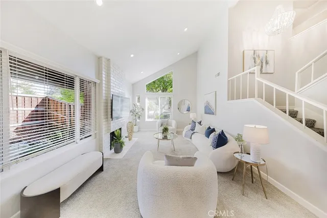 a living room with furniture and a painting