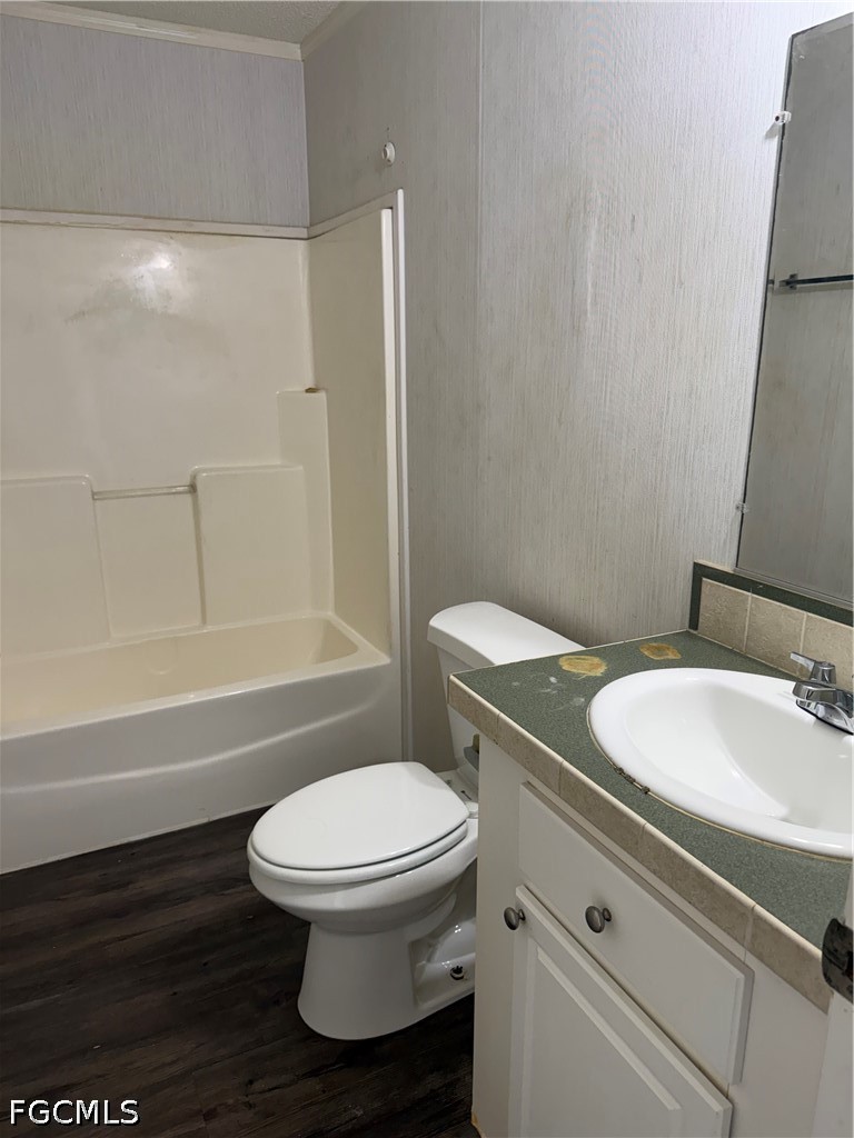 1660 Evans Road LaBelle, FL 33935 - Photo 9 of 10 a bathroom with a sink a toilet and a bathtub