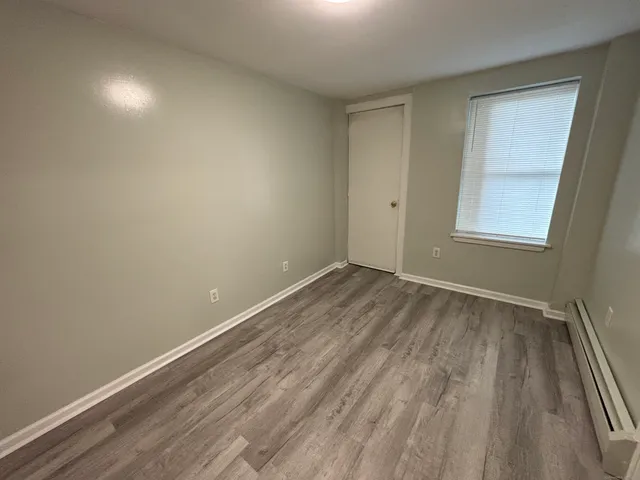 wooden floor and window in a room