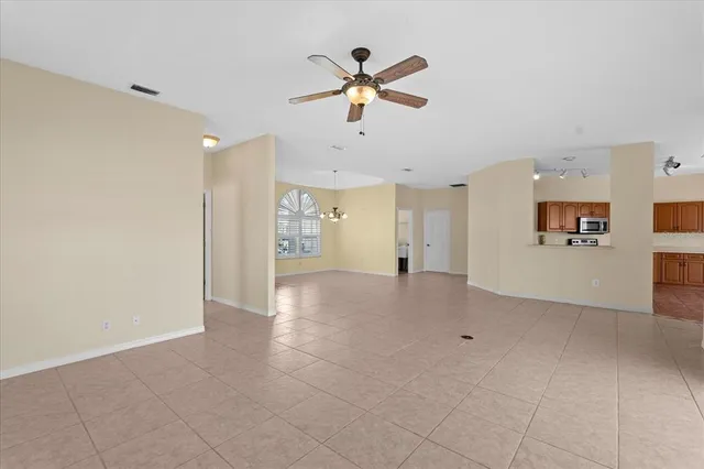 a view of an empty room with a fireplace
