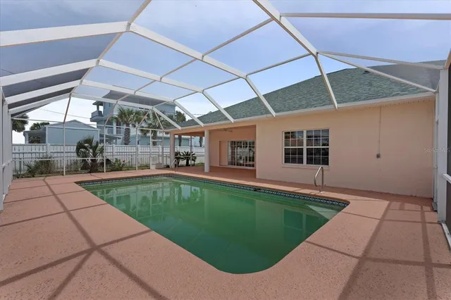 a view of a swimming pool with a yard