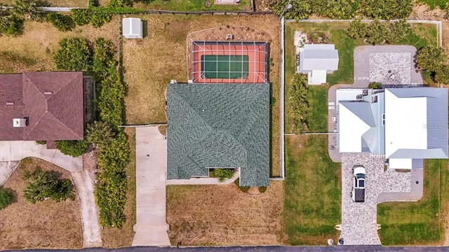 an aerial view of residential houses with outdoor space