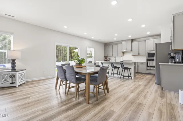 a view of a backyard with a swimming pool
