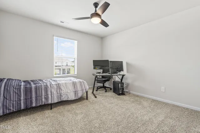 a spacious bathroom with a shower a sink and a mirror