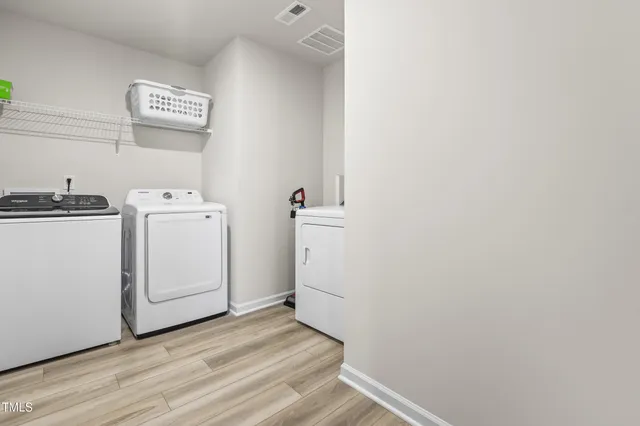a living room with a bed furniture and a window