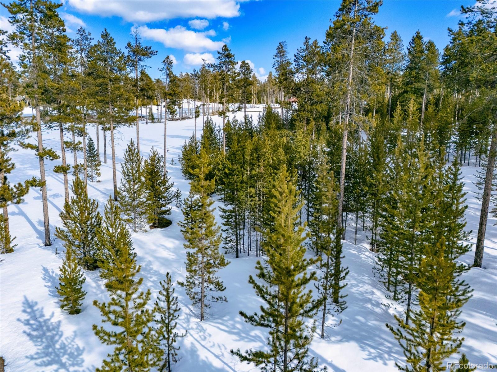 90 5th Street Tabernash, CO 80478 - Photo 12 of 17 a view of a lake with a building in the background