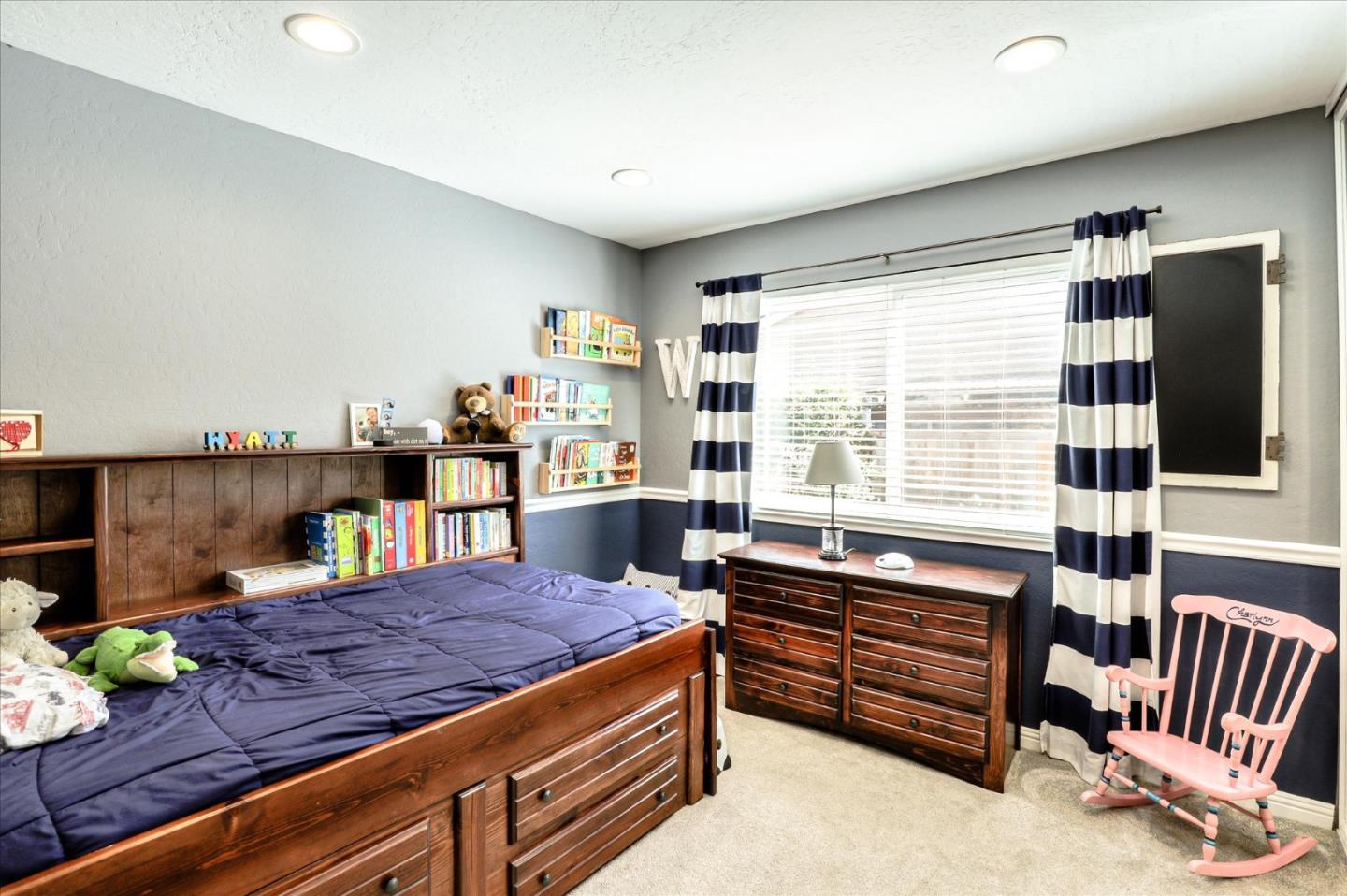 470 Corte Cabanil Morgan Hill, CA 95037 - Photo 15 of 22 a living room with furniture and a floor to ceiling window