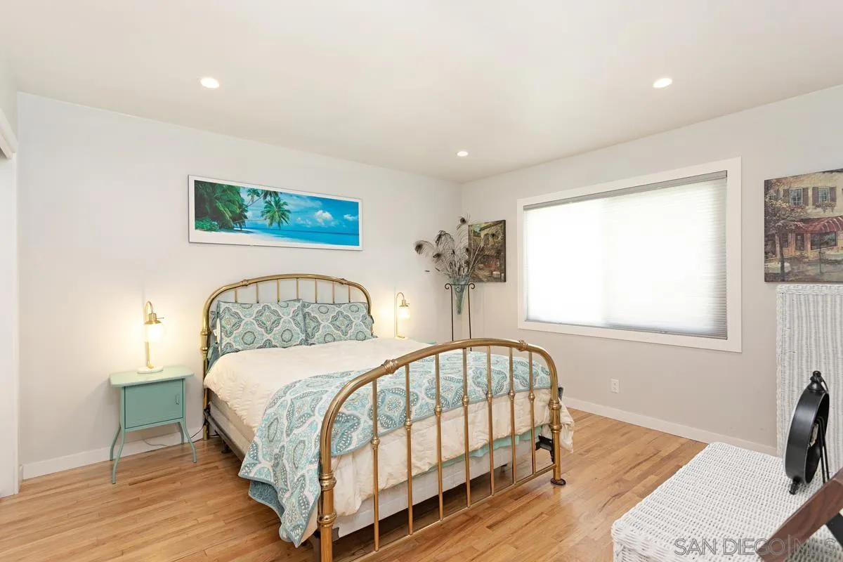 2435 Tuttle Street Carlsbad, CA 92008 - Photo 20 of 38 a bedroom with a bed and a window