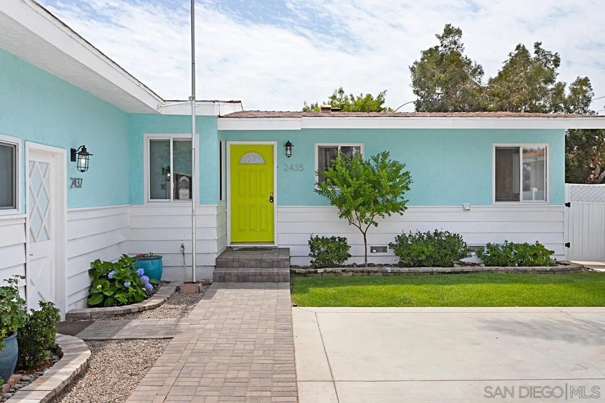 2435 Tuttle Street Carlsbad, CA 92008 - Photo 3 of 38 a front view of a house with garden