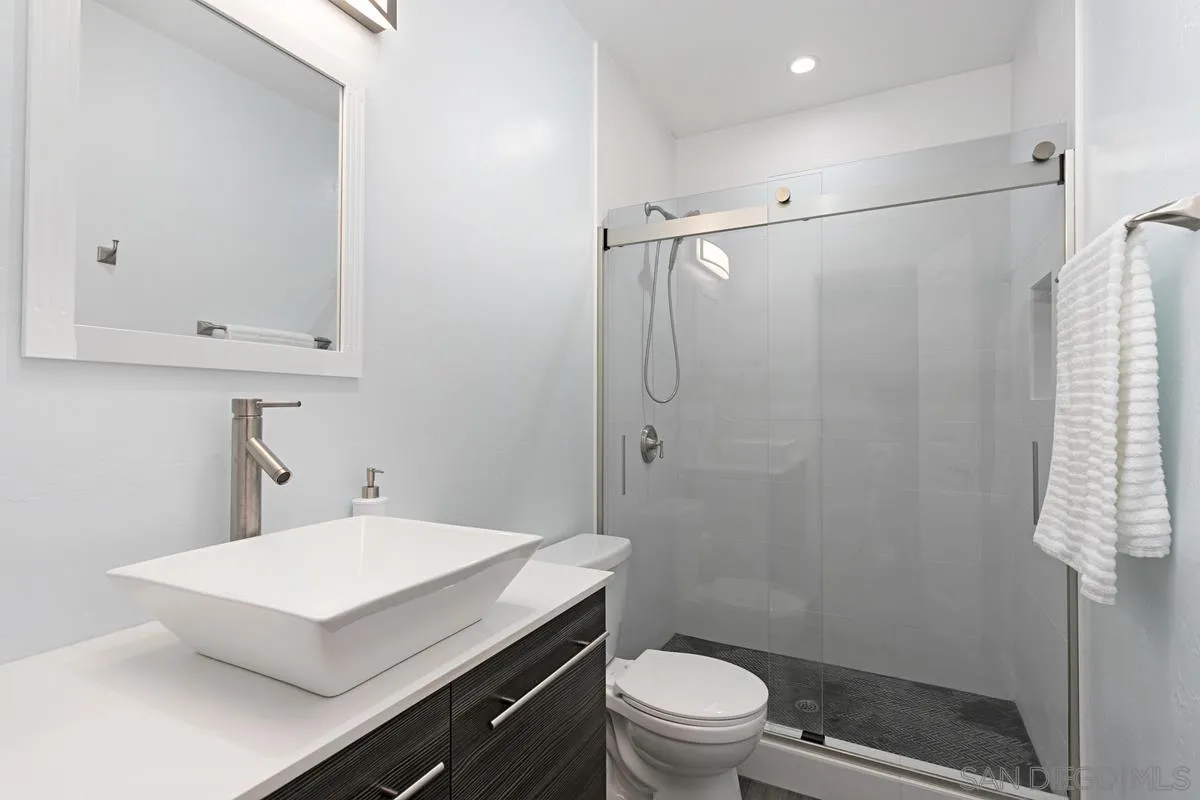 2435 Tuttle Street Carlsbad, CA 92008 - Photo 38 of 38 a bathroom with a sink toilet and shower