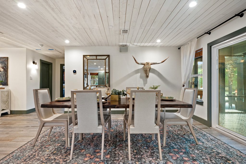 2800 River Road Wimberley, TX 78676 - Photo 15 of 38 Dining area featuring light wood-style flooring, wood ceiling, and recessed lighting