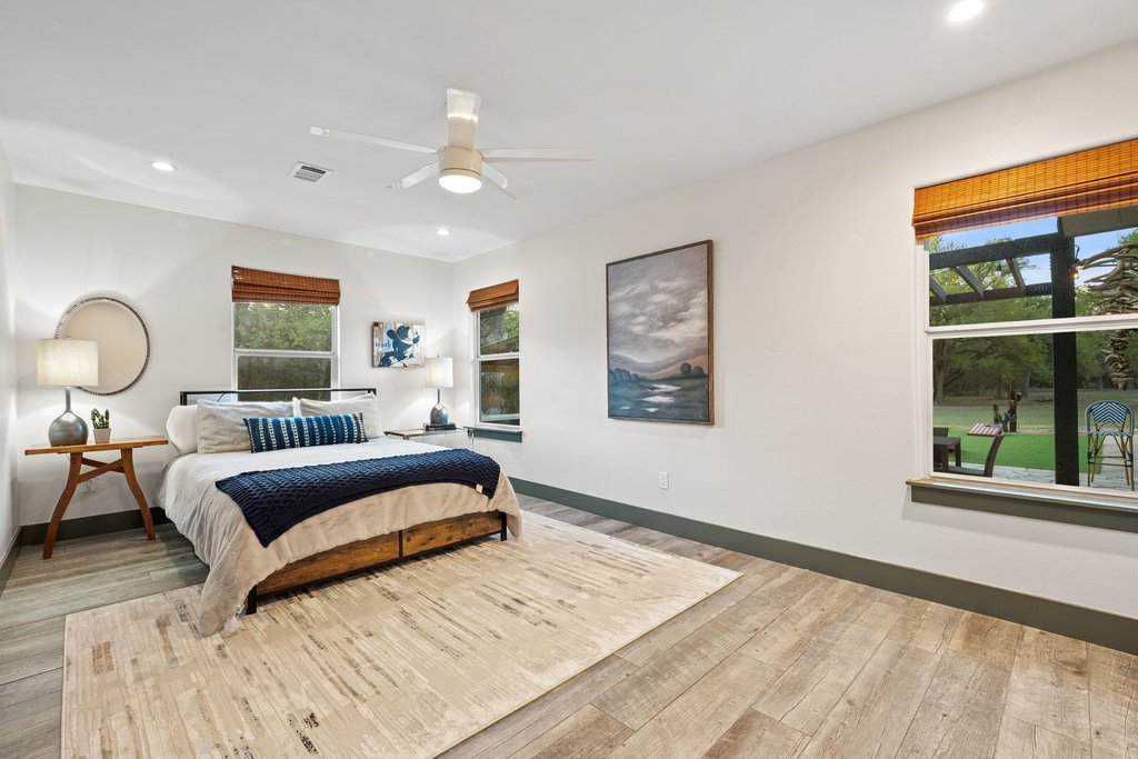 2800 River Road Wimberley, TX 78676 - Photo 23 of 38 Bedroom featuring light wood finished floors, recessed lighting, and ceiling fan