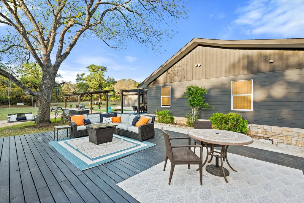 2800 River Road Wimberley, TX 78676 - Photo 7 of 38 Expansive outdoor decking featuring a dark wood-finish surface