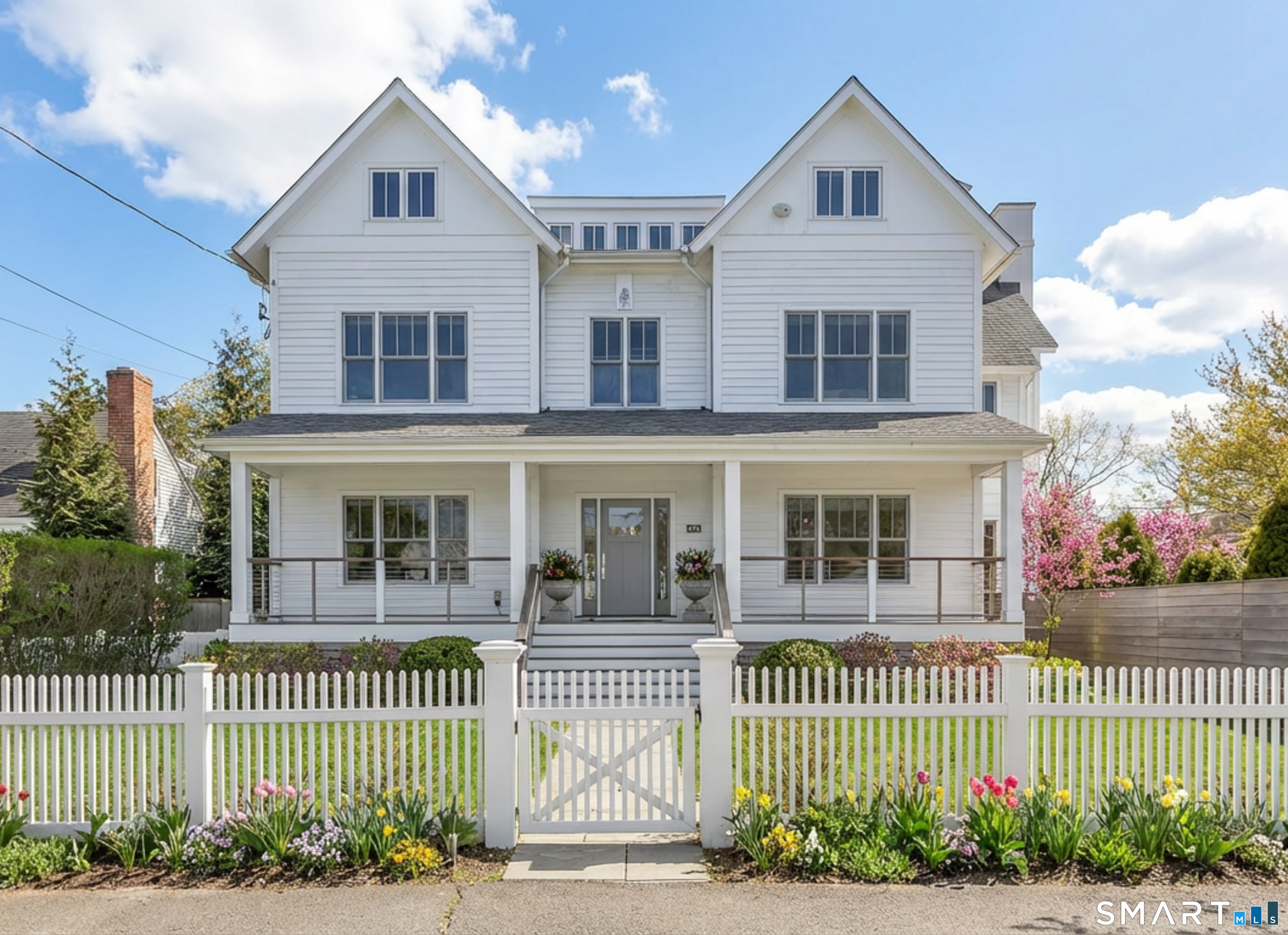 a front view of a house with a garden