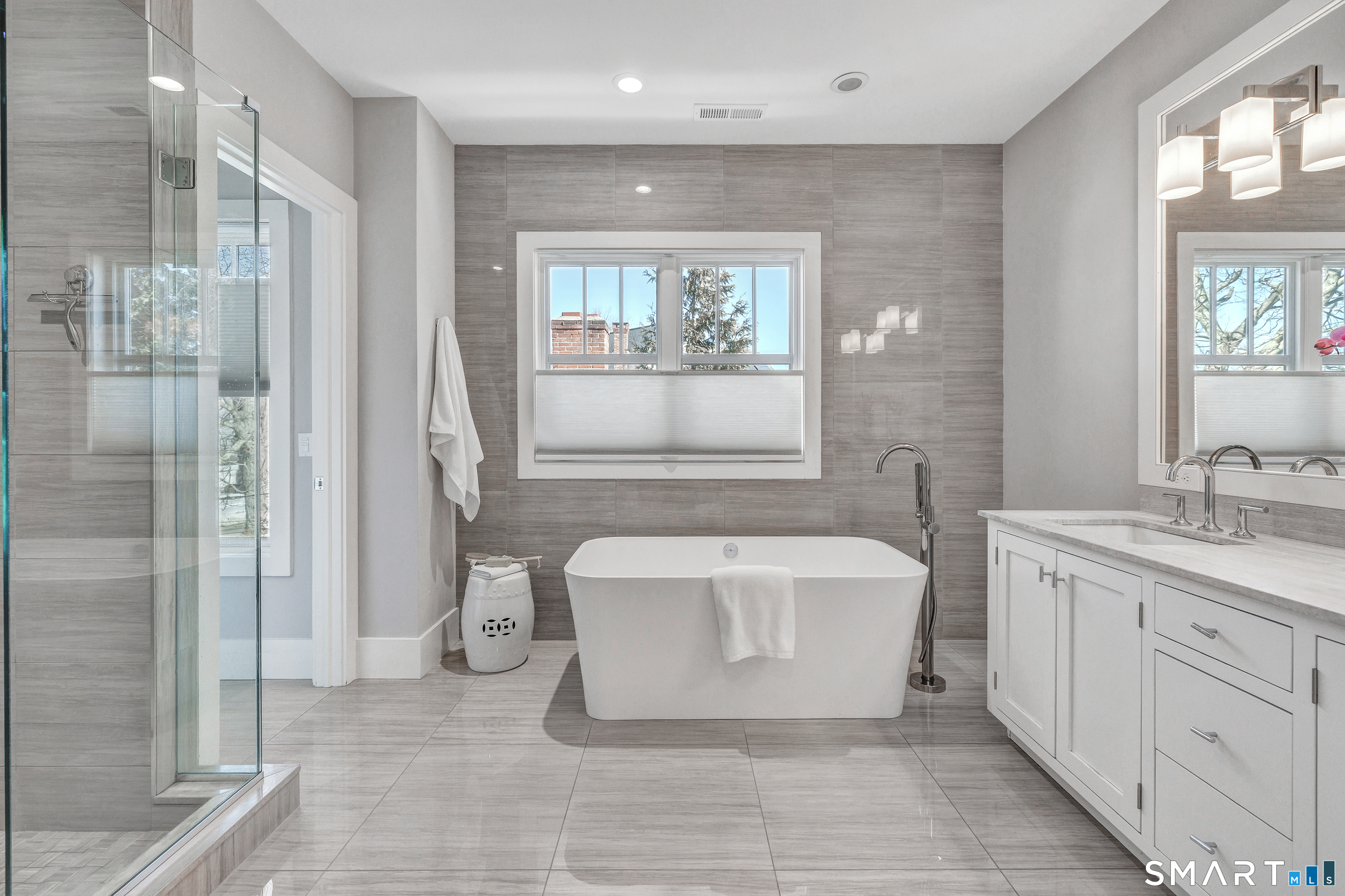 598 South Benson Road Fairfield, CT 06824 - Photo 20 of 40 a spacious bathroom with a tub shower and sink