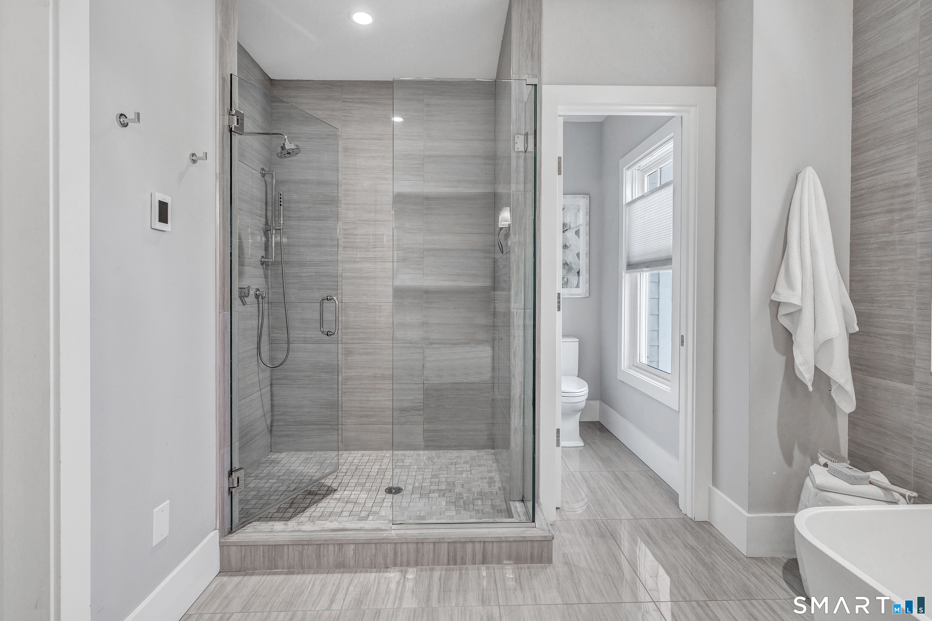 598 South Benson Road Fairfield, CT 06824 - Photo 21 of 40 a bathroom with a shower and a toilet