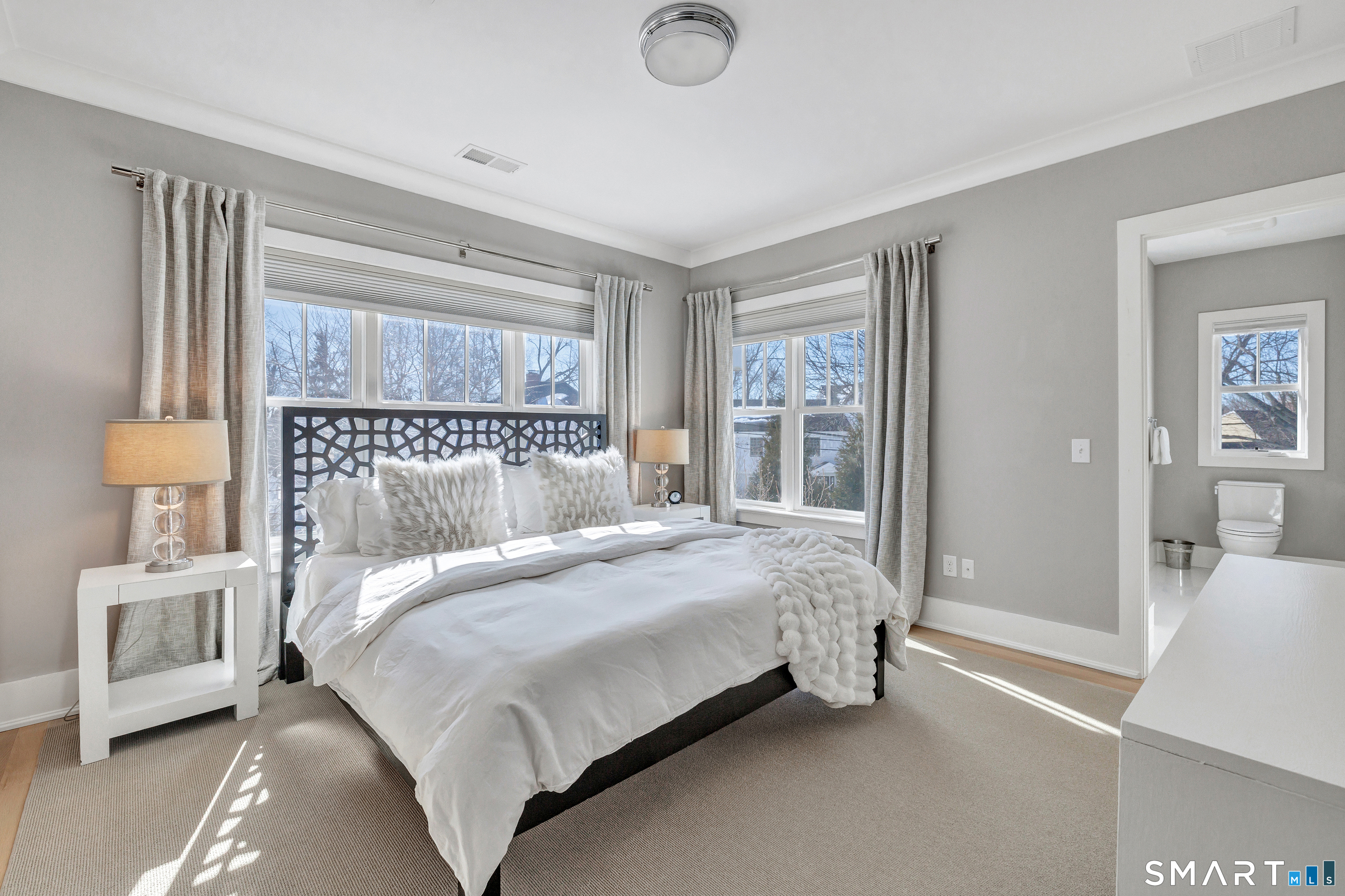 598 South Benson Road Fairfield, CT 06824 - Photo 26 of 40 a bedroom with a bed and a window