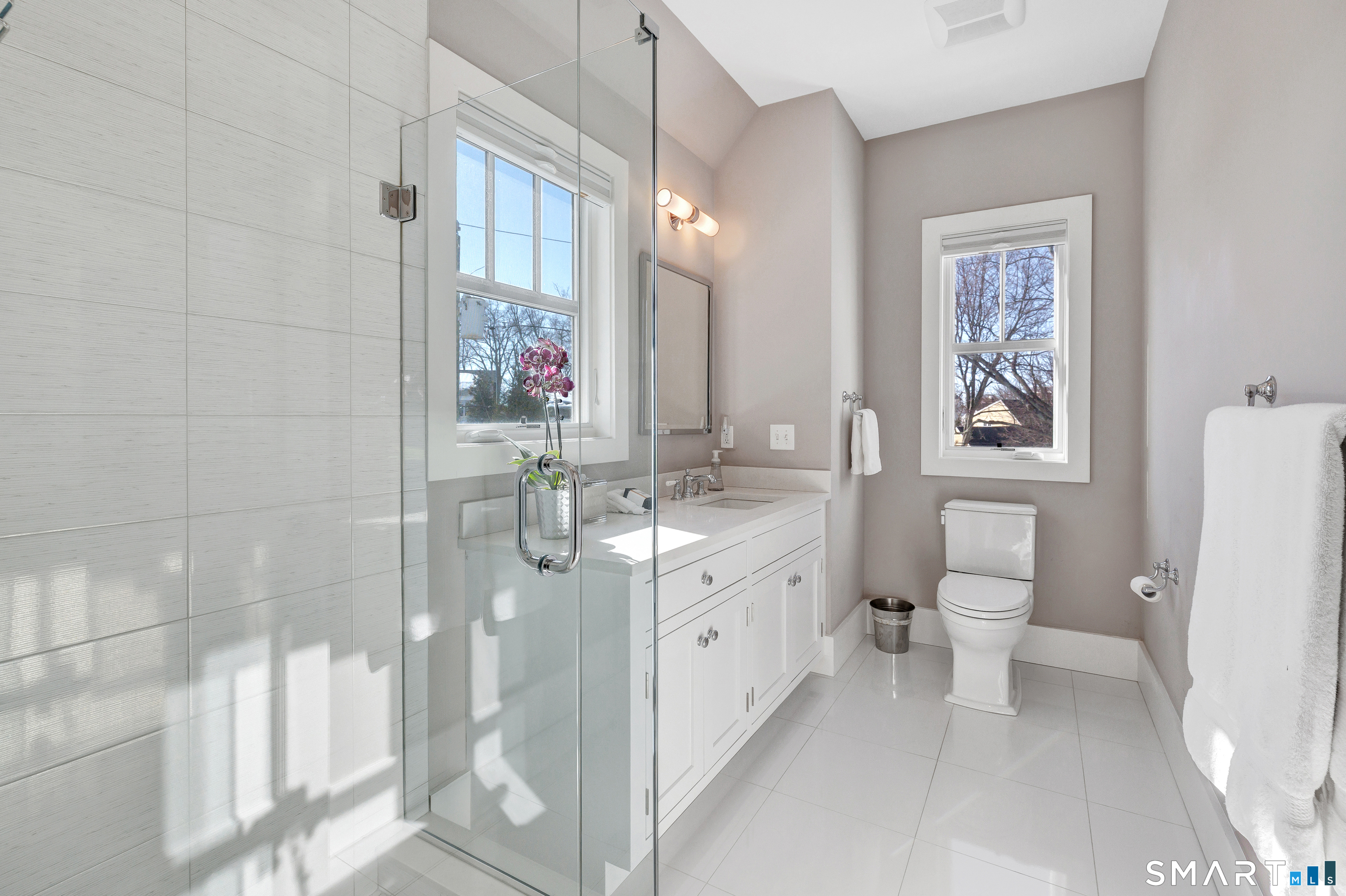 598 South Benson Road Fairfield, CT 06824 - Photo 27 of 40 a bathroom with a double vanity sink toilet and shower