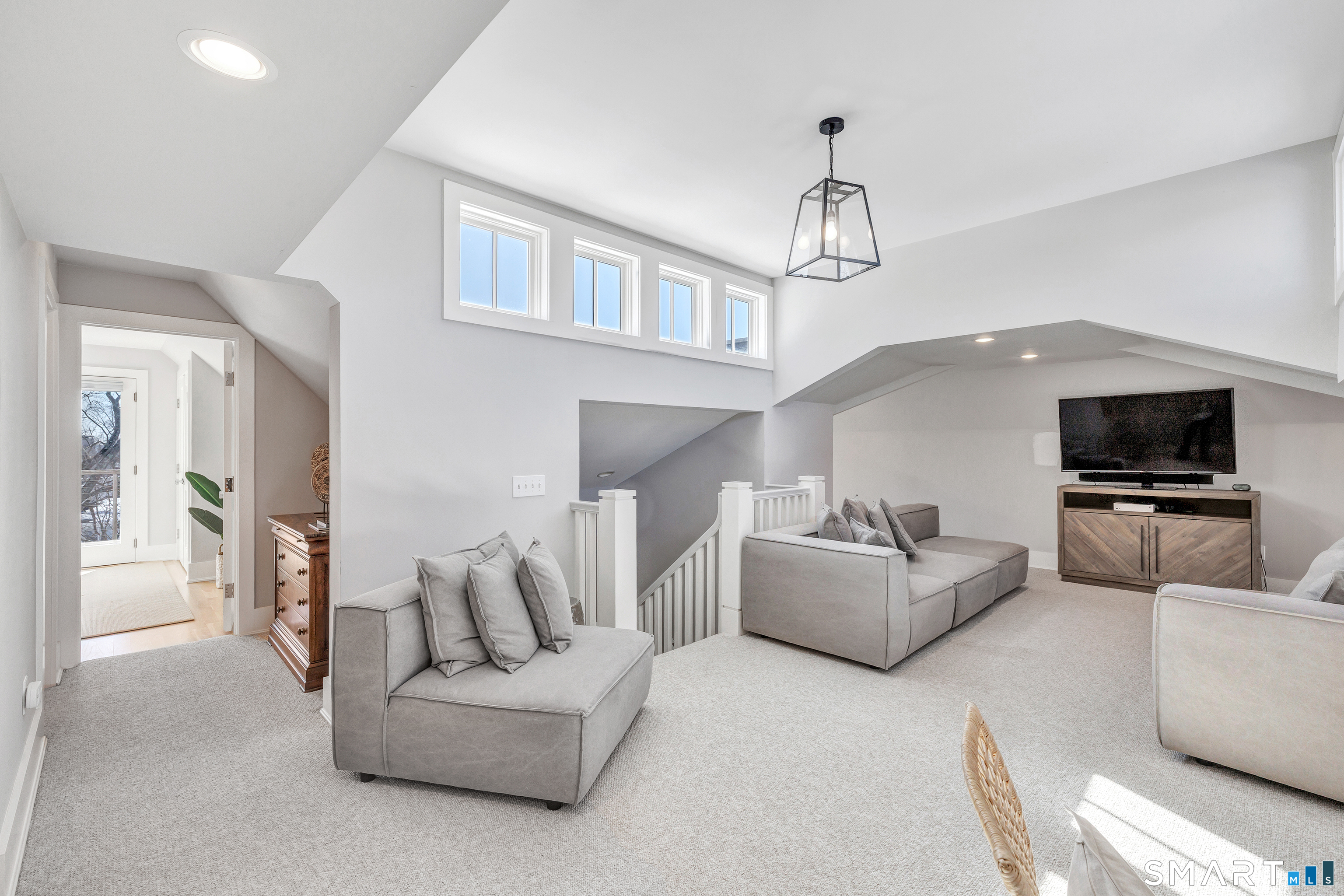 598 South Benson Road Fairfield, CT 06824 - Photo 31 of 40 a living room with furniture and a flat screen tv