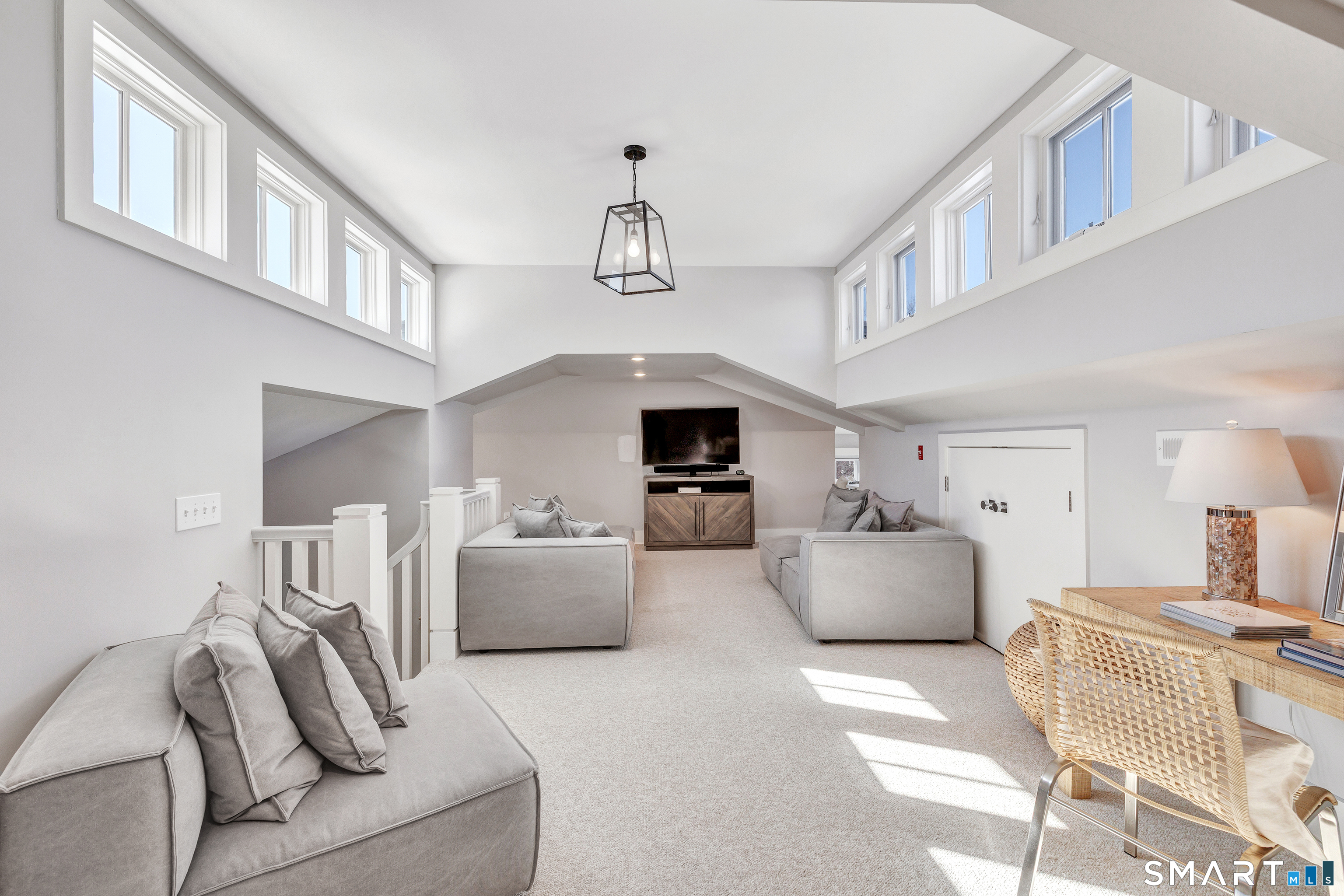 598 South Benson Road Fairfield, CT 06824 - Photo 33 of 40 a living room with furniture and a ceiling fan