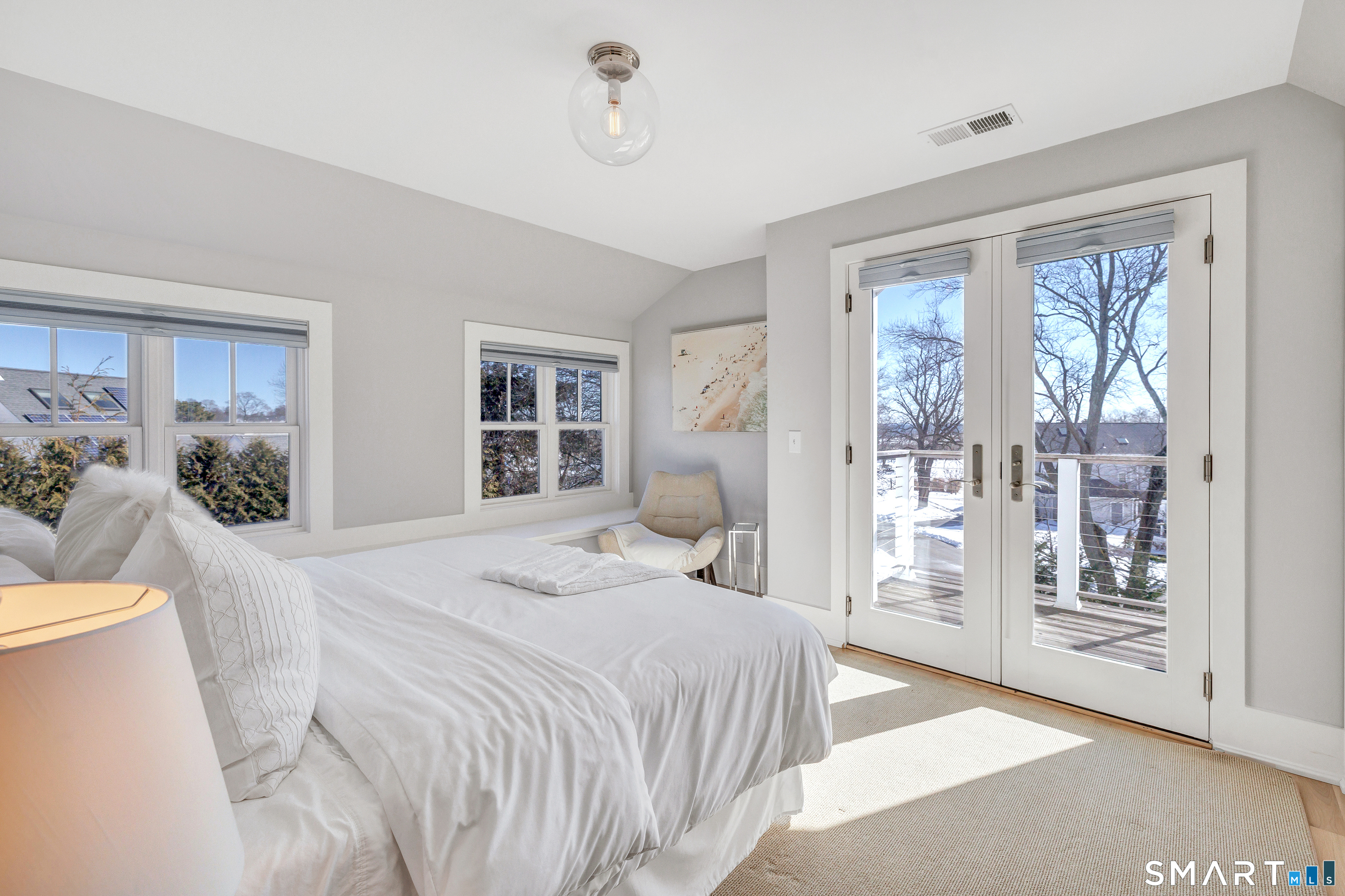 598 South Benson Road Fairfield, CT 06824 - Photo 34 of 40 a bedroom with a large bed and a window