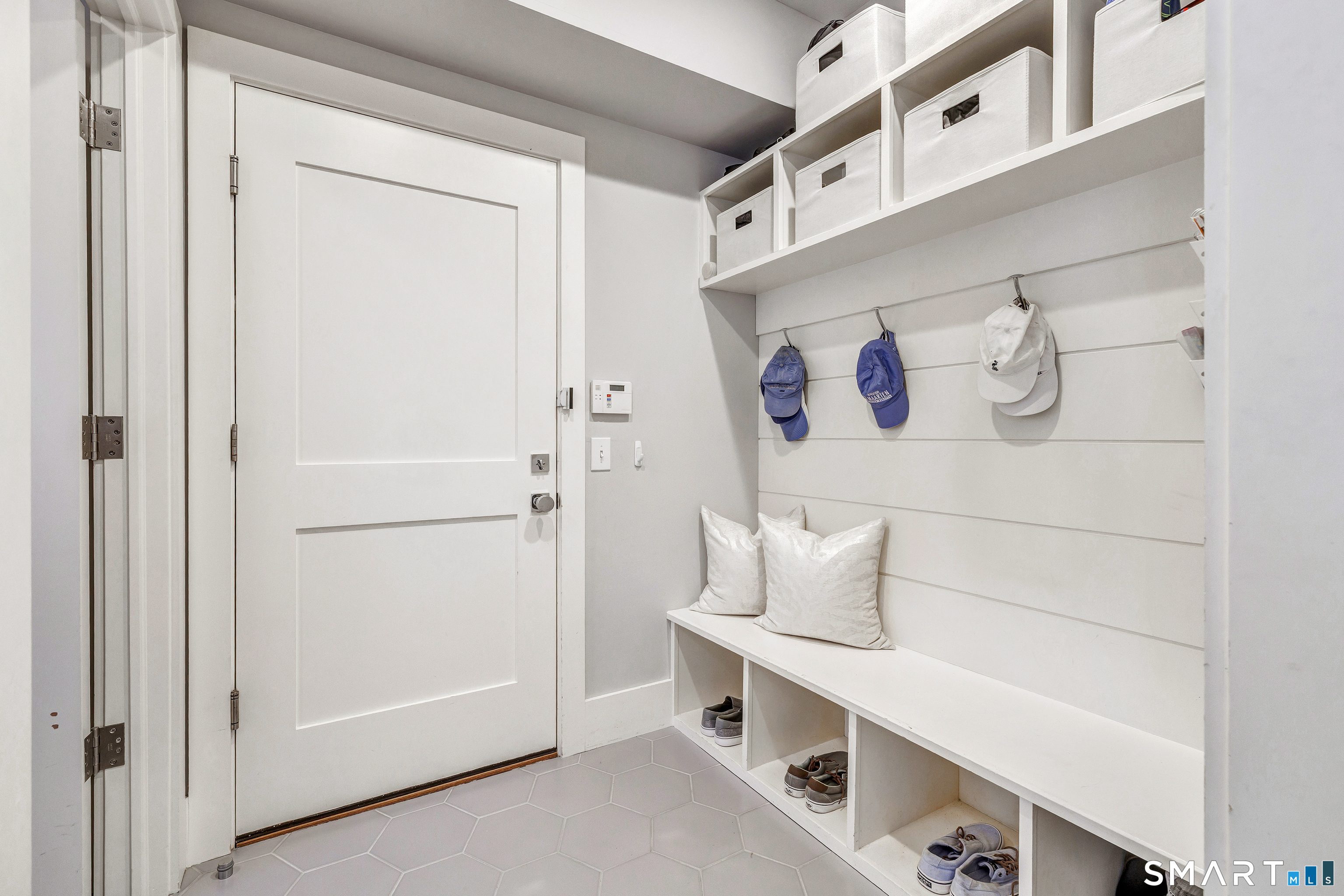 598 South Benson Road Fairfield, CT 06824 - Photo 36 of 40 a hallway with white cabinets and white walls