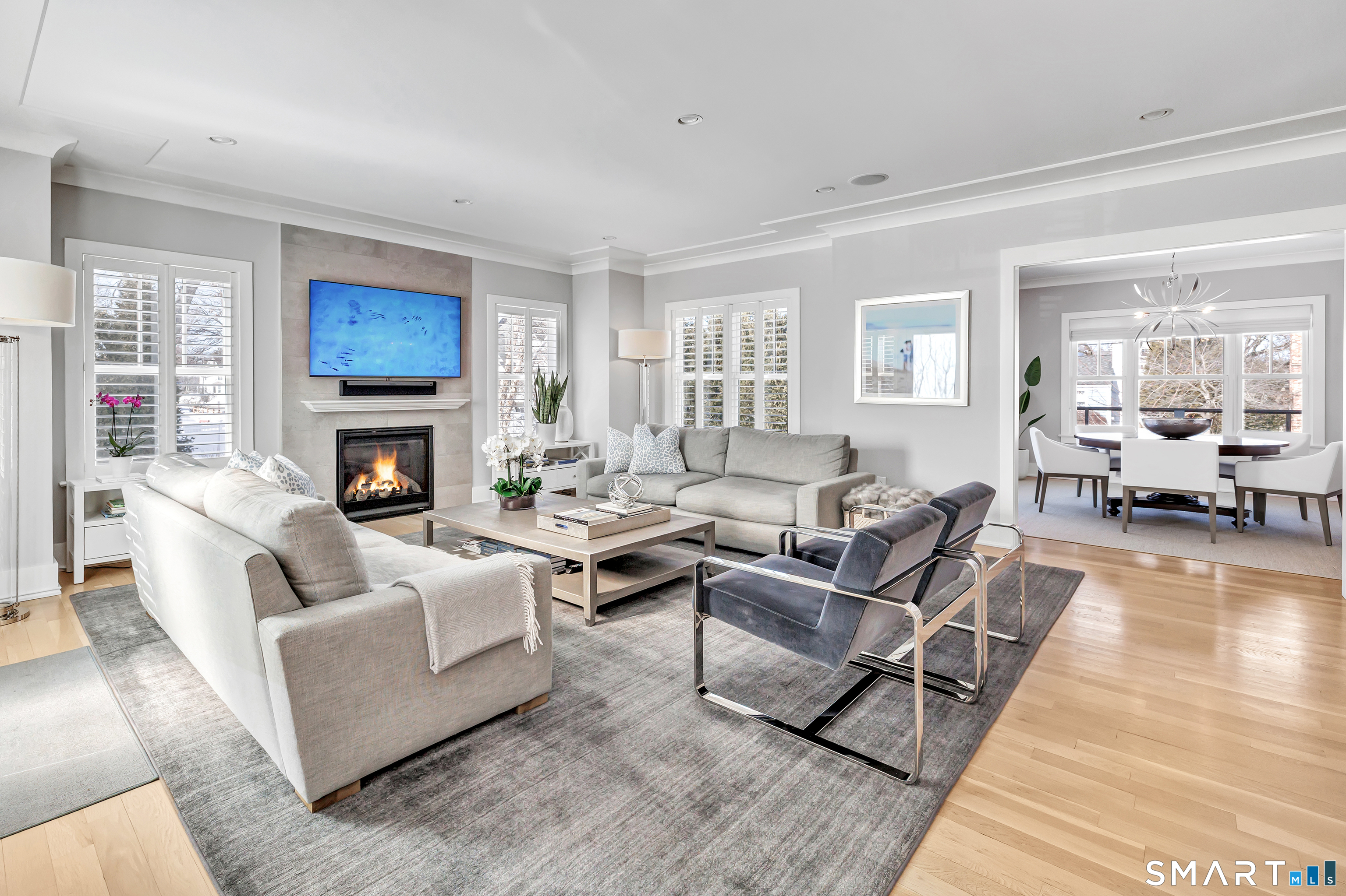 598 South Benson Road Fairfield, CT 06824 - Photo 10 of 40 a living room with furniture or couch and a fireplace