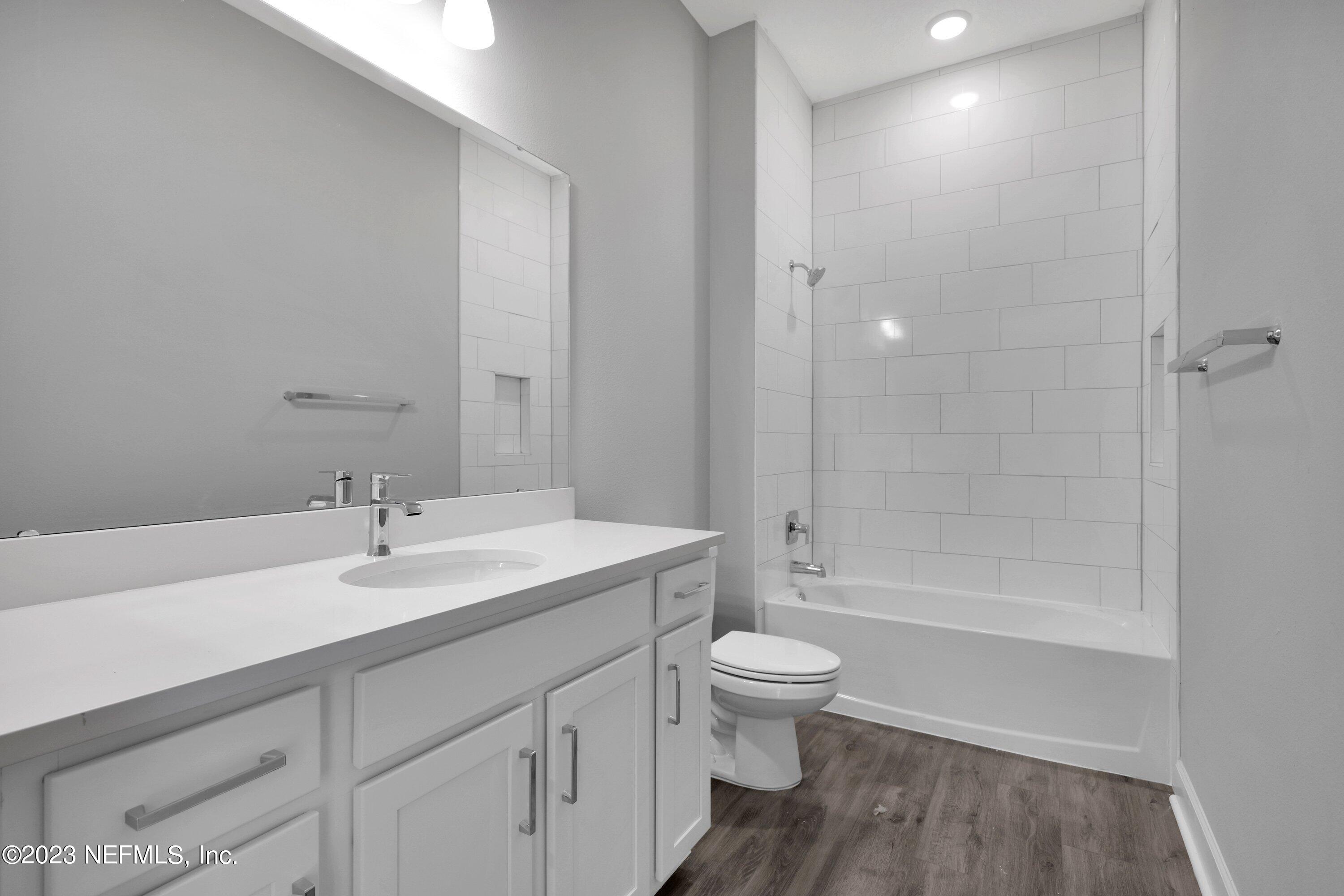 11243 Bright Path Jacksonville, FL 32256 - Photo 27 of 38 a bathroom with a sink a toilet and shower