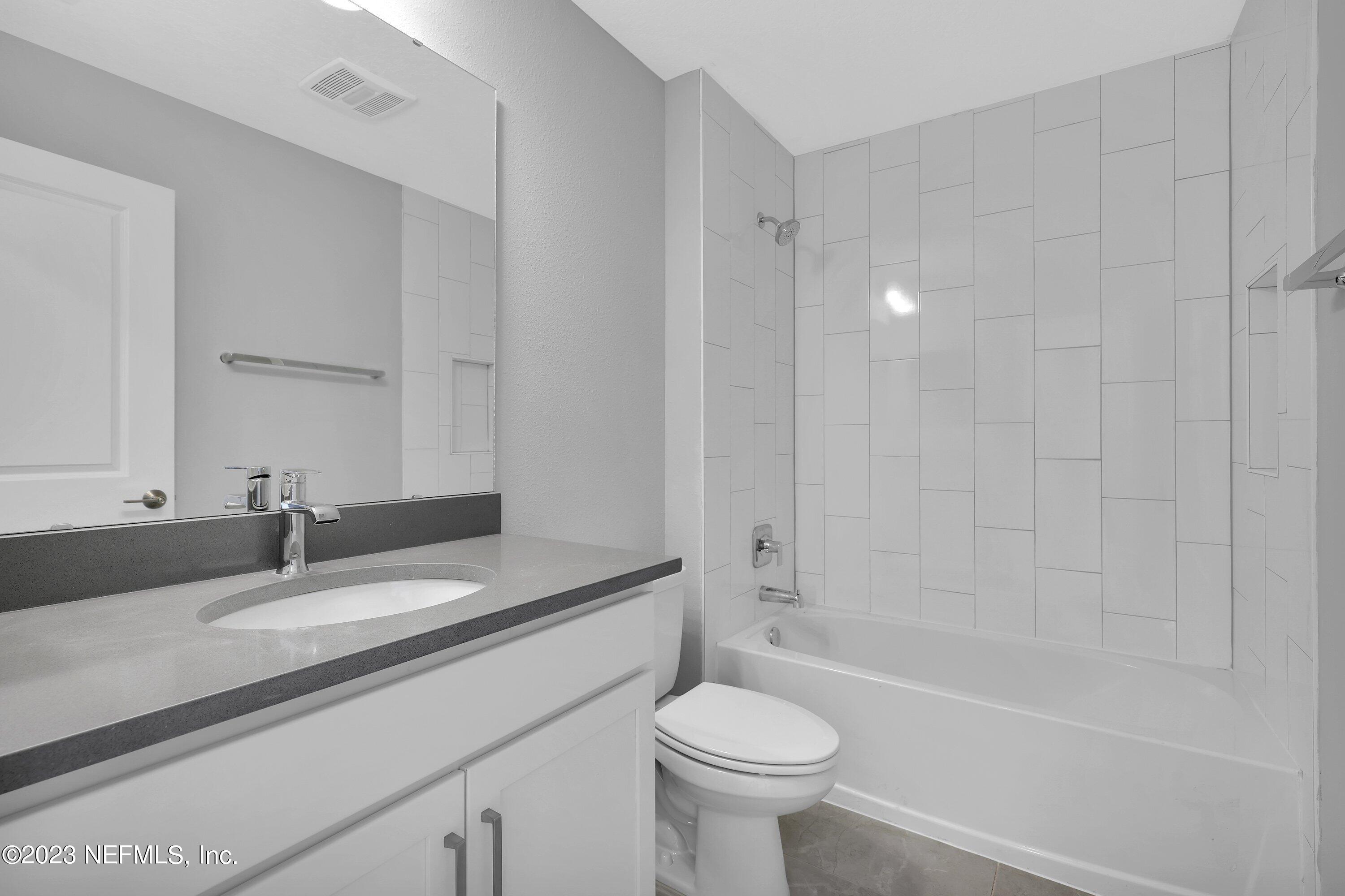 11243 Bright Path Jacksonville, FL 32256 - Photo 33 of 38 a bathroom with a sink a toilet and shower