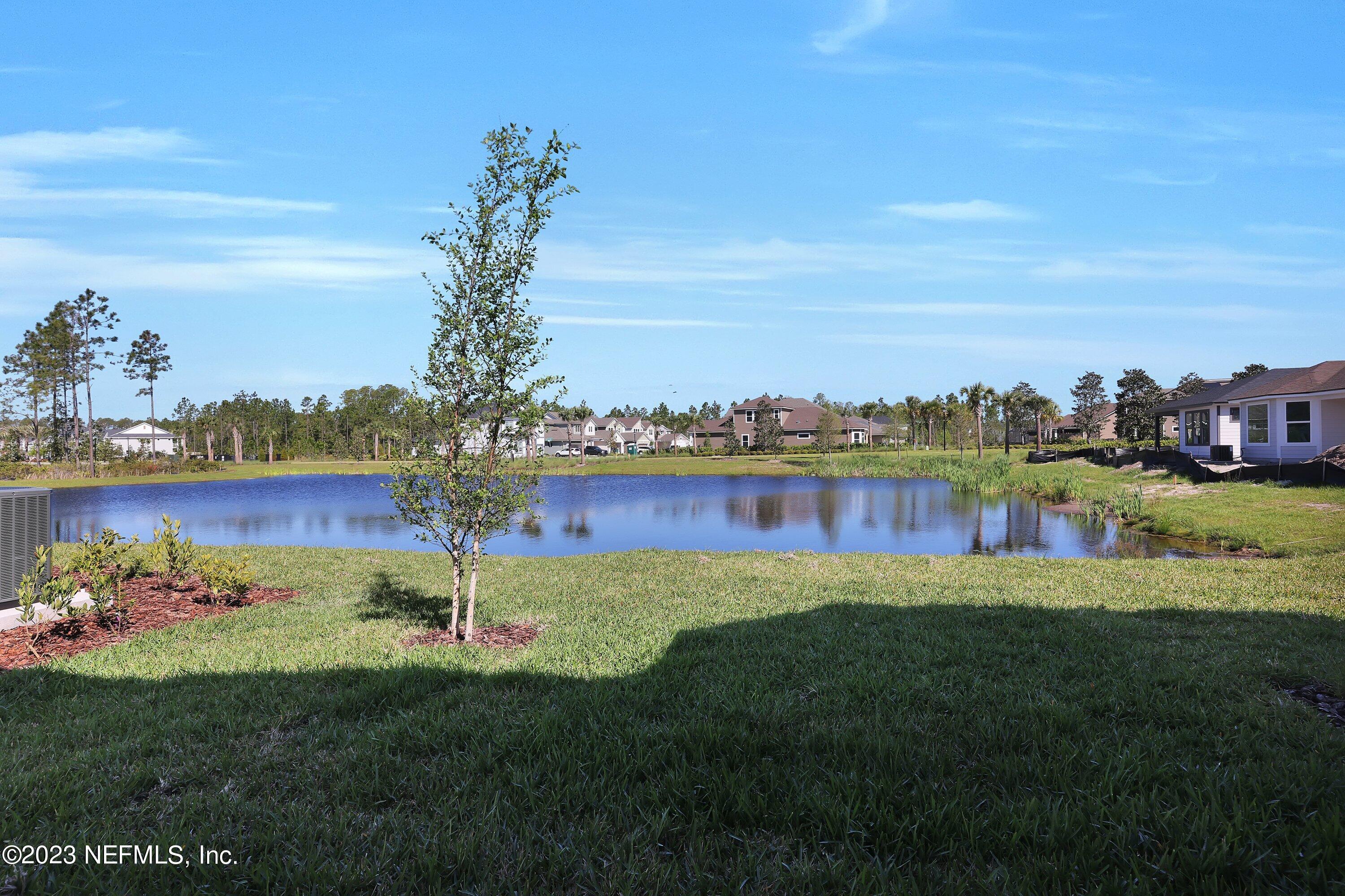11243 Bright Path Jacksonville, FL 32256 - Photo 36 of 38 a view of a lake with houses in the back
