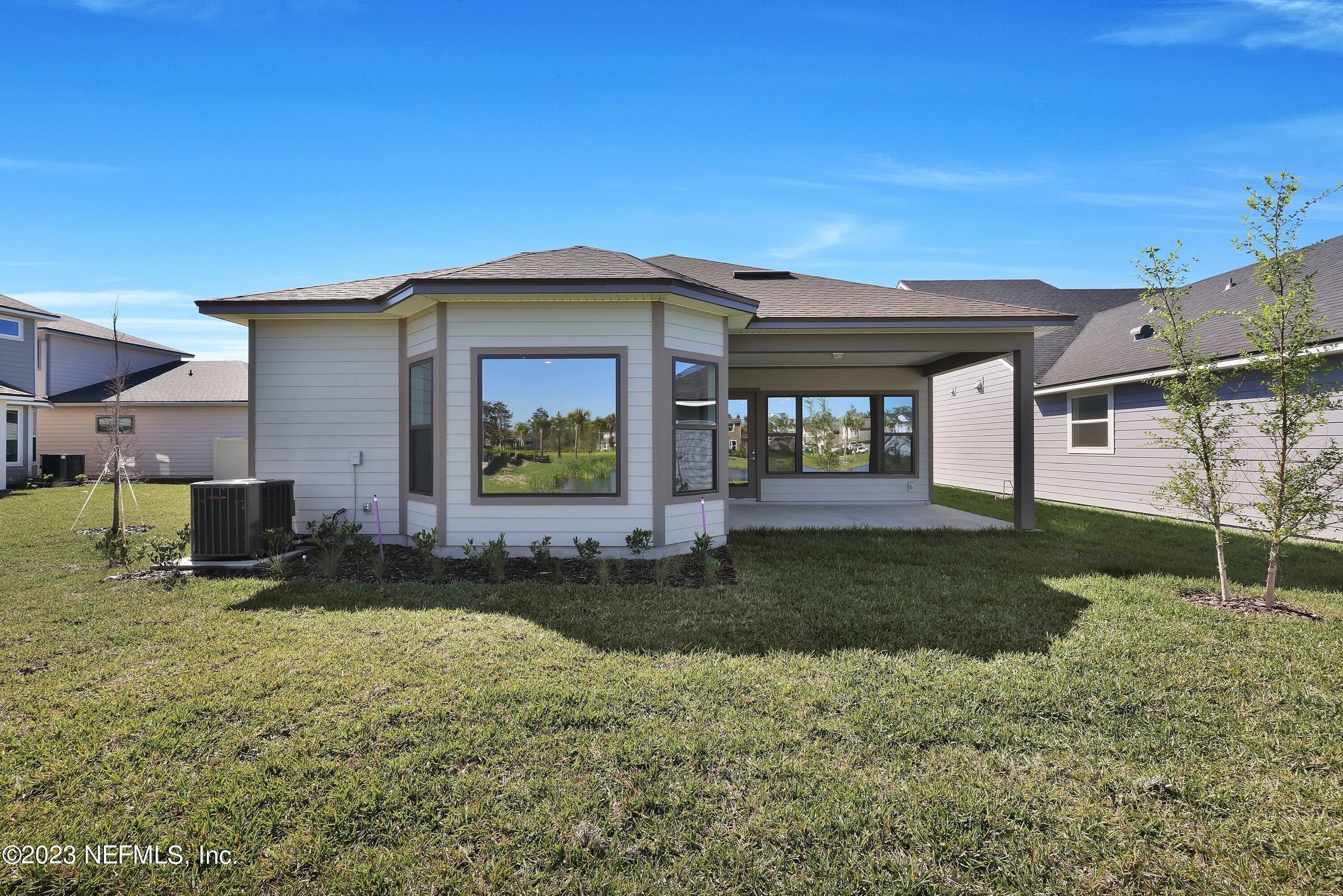 11243 Bright Path Jacksonville, FL 32256 - Photo 38 of 38 a front view of a house with a yard