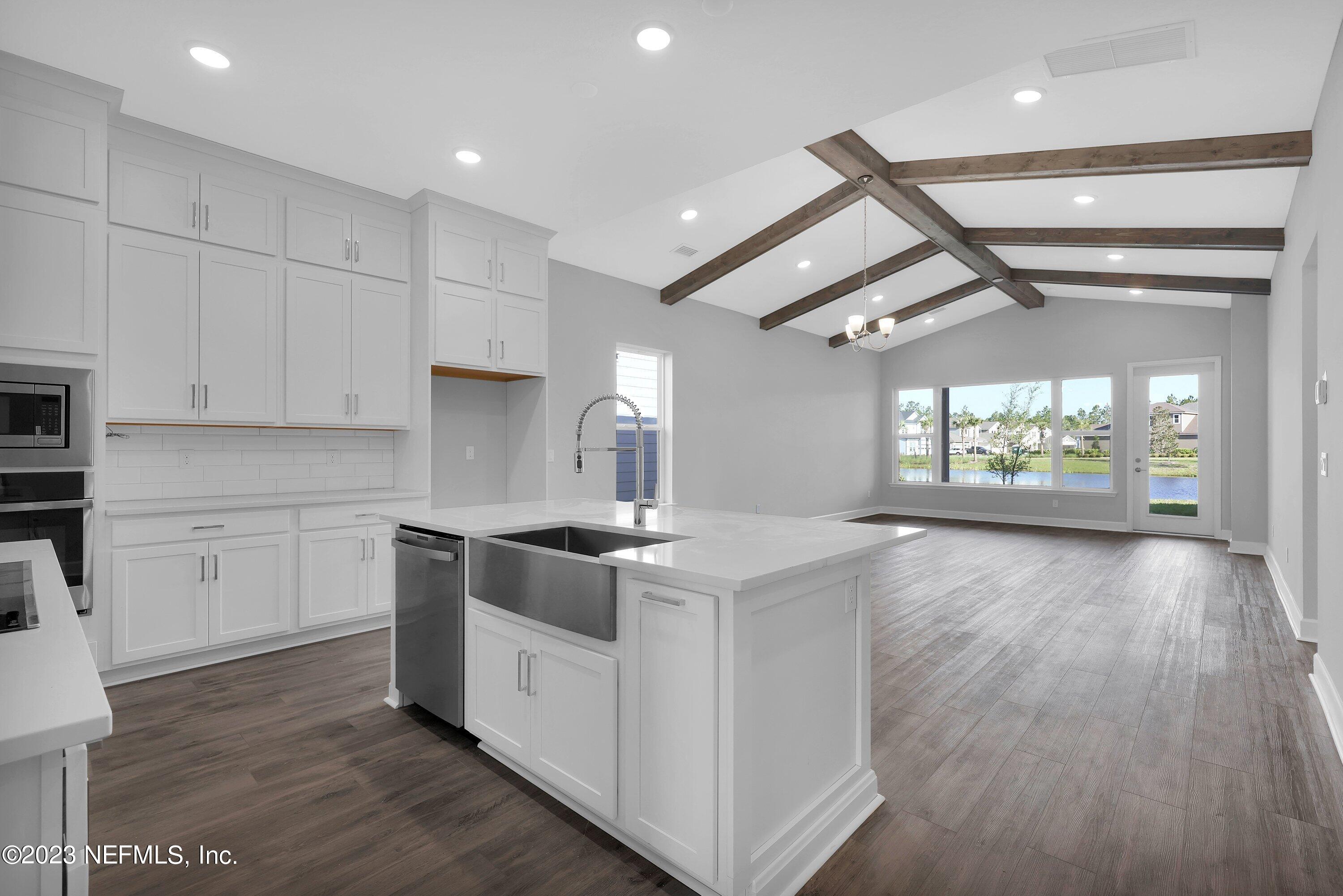 11243 Bright Path Jacksonville, FL 32256 - Photo 9 of 38 a kitchen with stainless steel appliances granite countertop a stove and a refrigerator