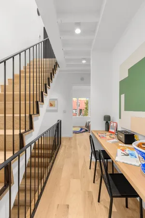 a view of a dining room with furniture window and wooden floor