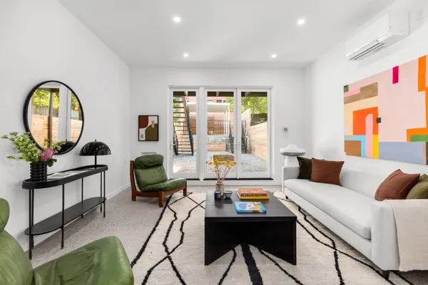 a living room with furniture and a large window