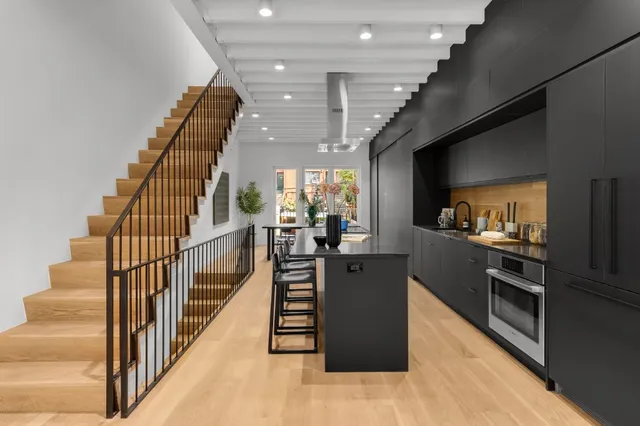 a view of a kitchen with furniture and a kitchen