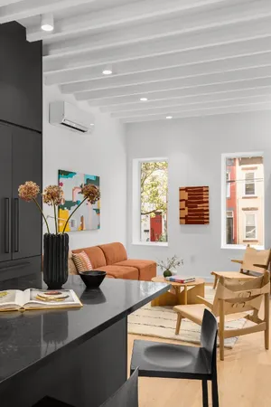 a kitchen with a table chairs and a sink