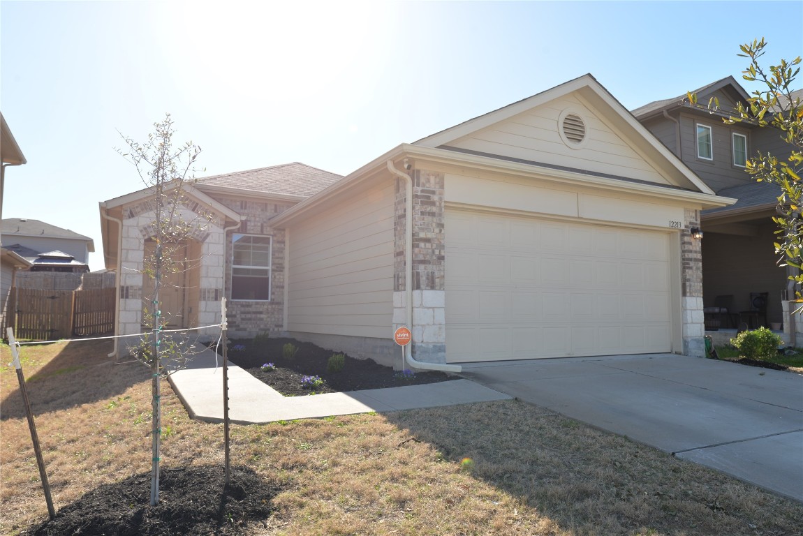 12213 Riprap Drive Manor, TX 78653 - Photo 1 of 1 a house view with a outdoor space