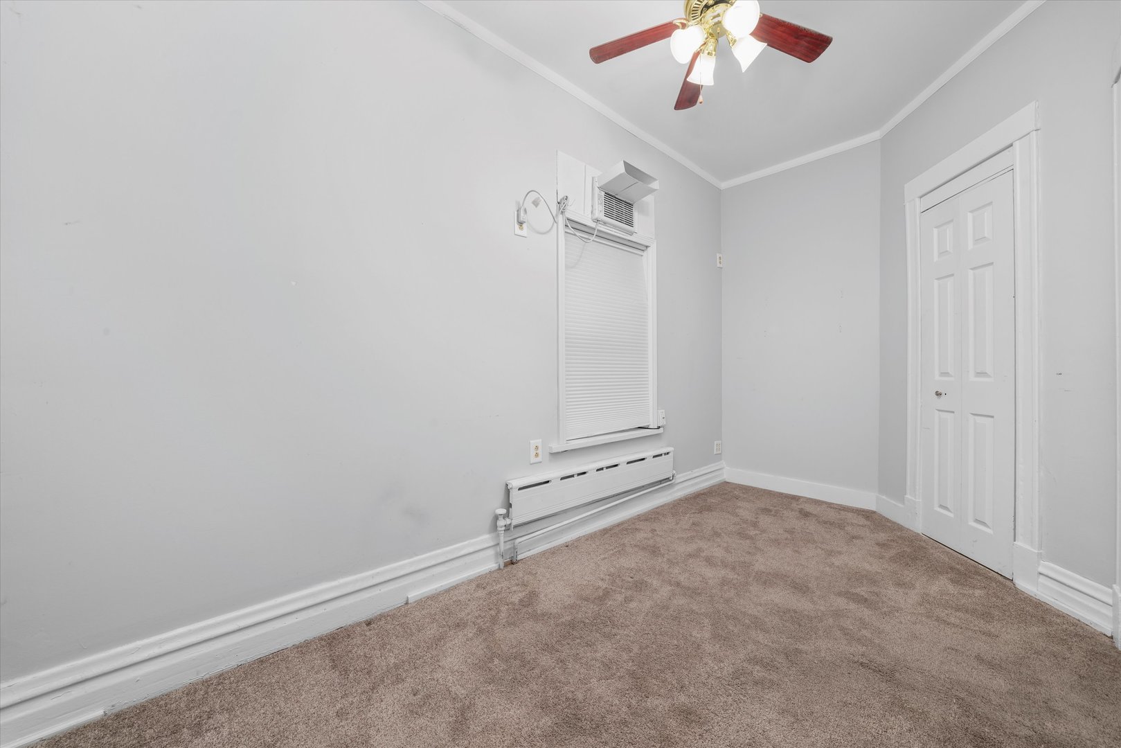 1450 North Springfield Avenue Chicago, IL 60651 - Photo 12 of 46 an empty room with fan