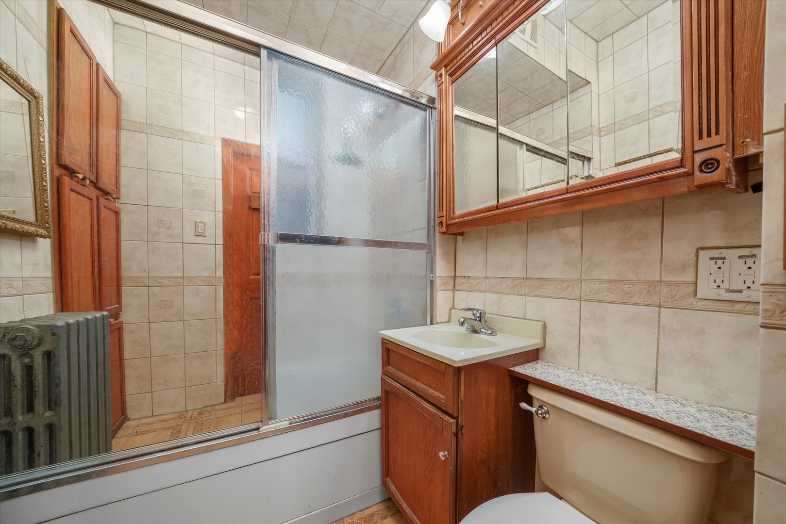 1450 North Springfield Avenue Chicago, IL 60651 - Photo 13 of 46 a bathroom with a sink and mirror