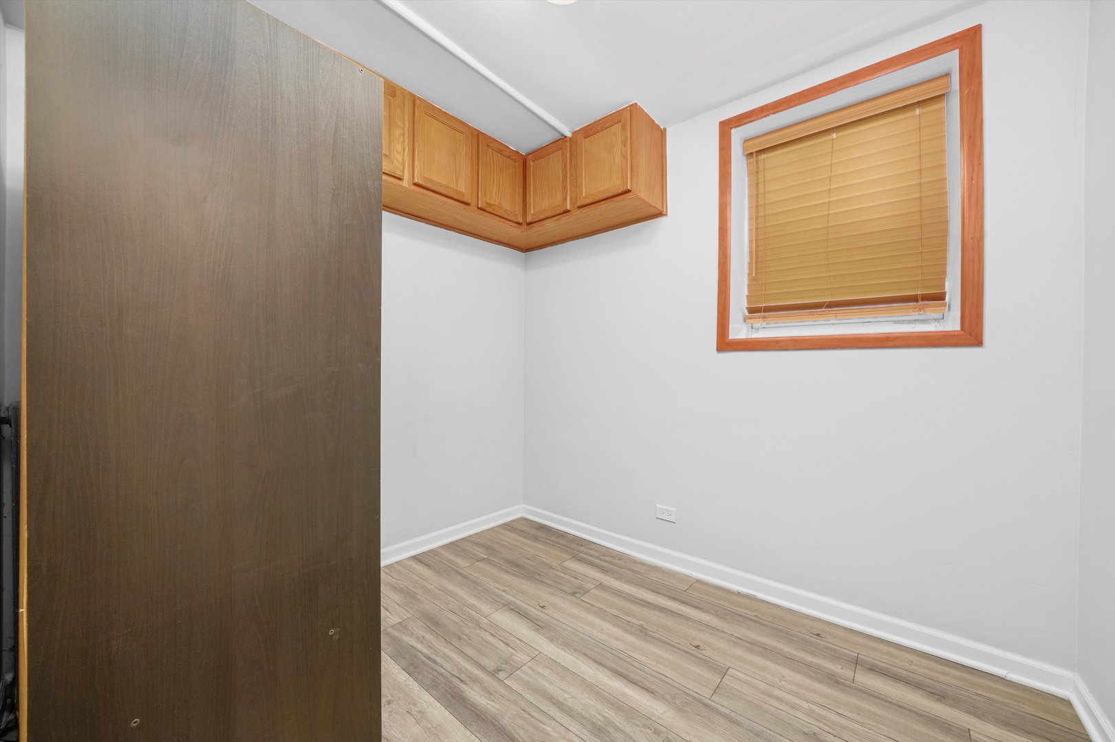 1450 North Springfield Avenue Chicago, IL 60651 - Photo 22 of 46 a view of a small space with wooden floor and a window
