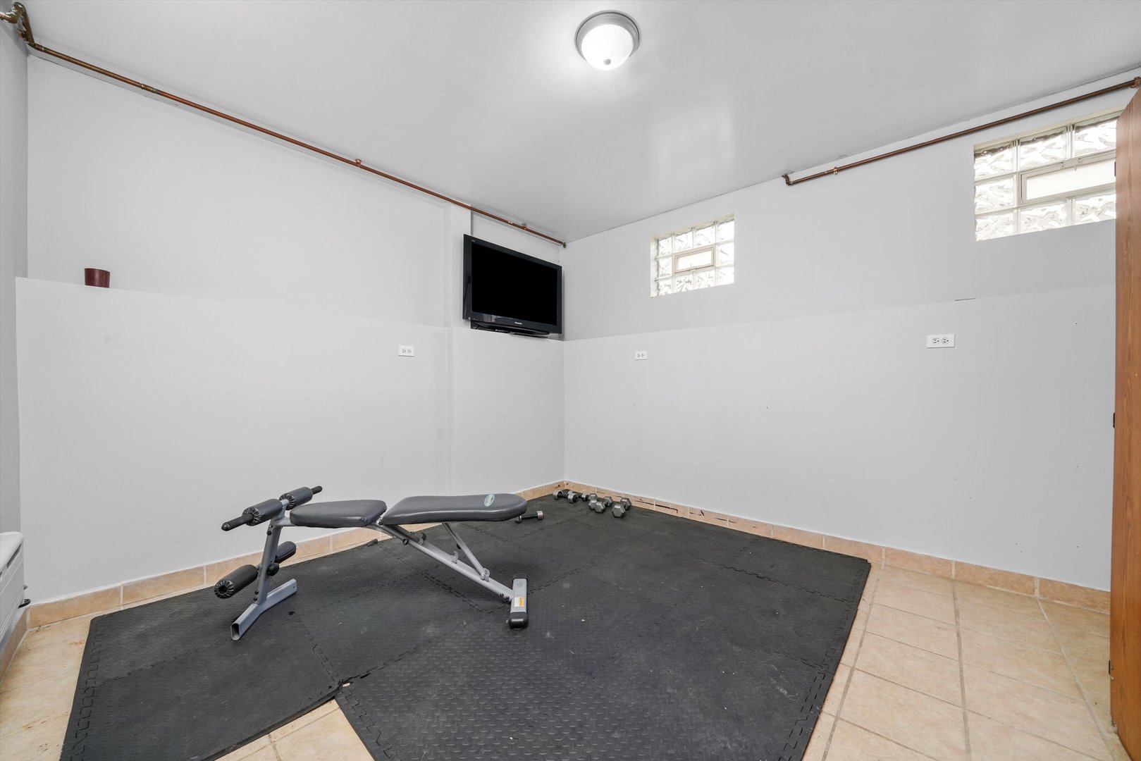 1450 North Springfield Avenue Chicago, IL 60651 - Photo 25 of 46 a view of a room with a flat screen tv