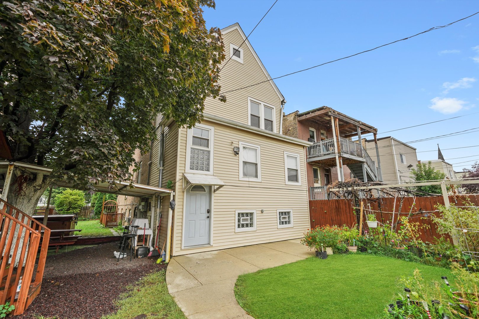1450 North Springfield Avenue Chicago, IL 60651 - Photo 31 of 46 a front view of a house with a garden