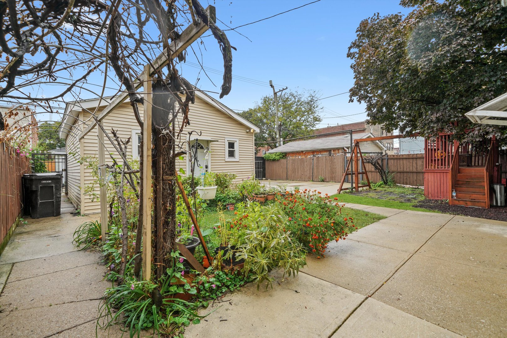 1450 North Springfield Avenue Chicago, IL 60651 - Photo 33 of 46 a front view of a house with garden
