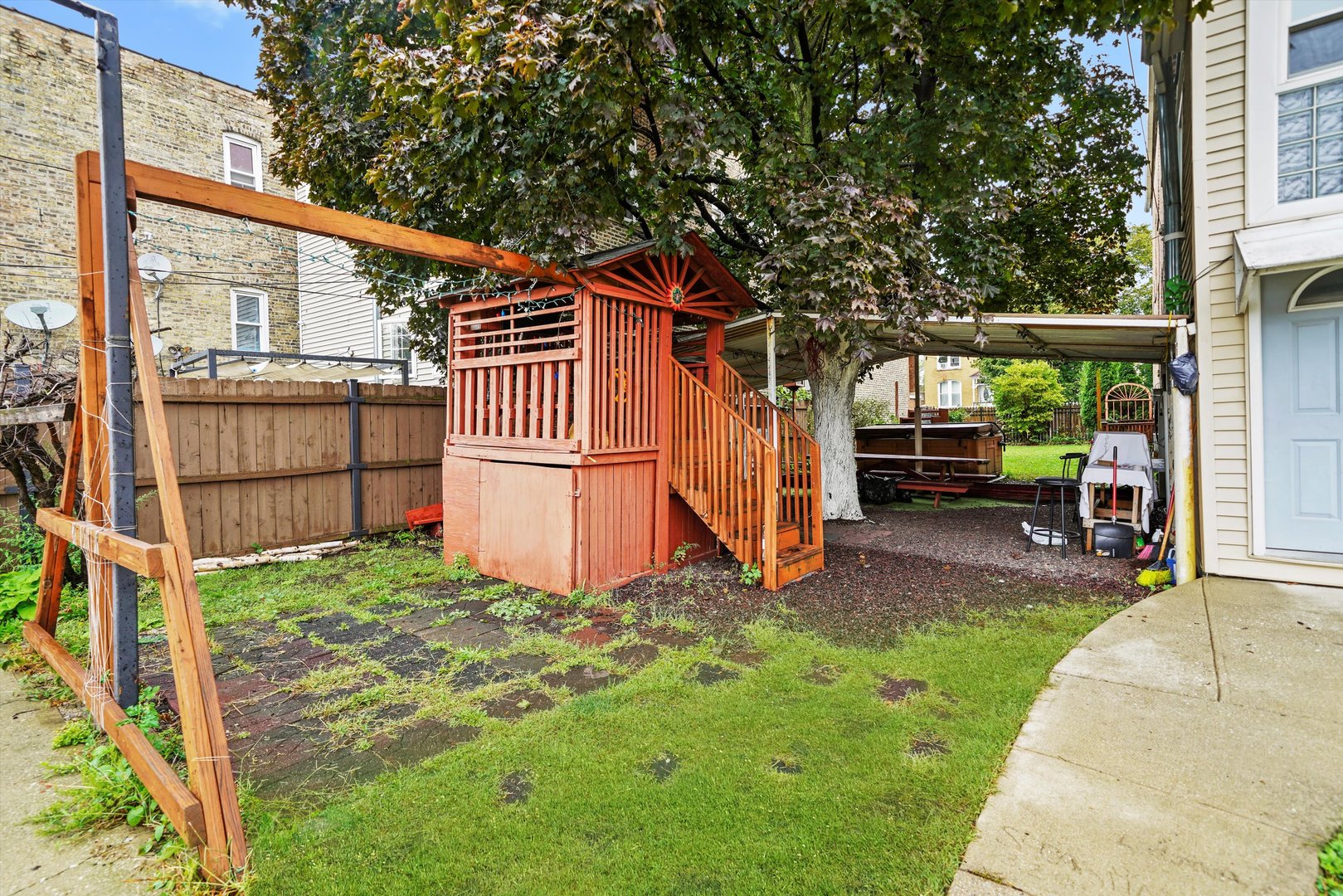 1450 North Springfield Avenue Chicago, IL 60651 - Photo 36 of 46 a view of a backyard with wooden fence and a bench