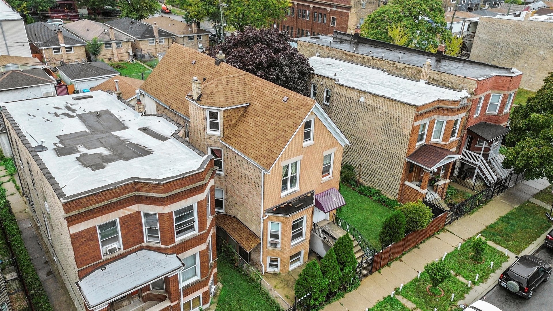 1450 North Springfield Avenue Chicago, IL 60651 - Photo 40 of 46 an aerial view of residential houses with yard