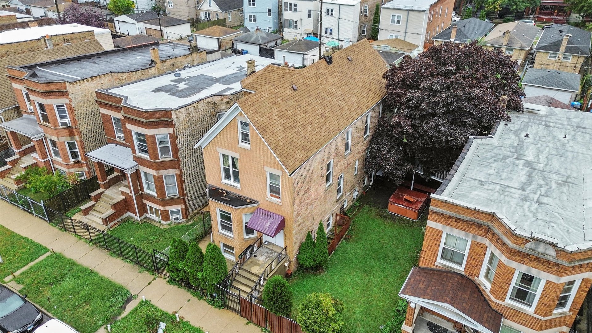 1450 North Springfield Avenue Chicago, IL 60651 - Photo 42 of 46 a aerial view of a residential apartment building with a yard