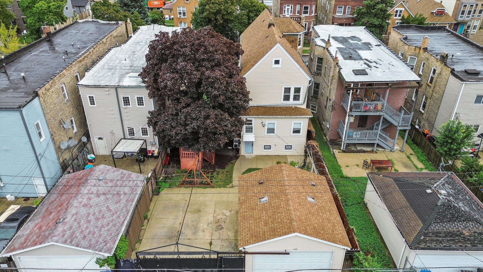1450 North Springfield Avenue Chicago, IL 60651 - Photo 44 of 46 a aerial view of a house with a yard