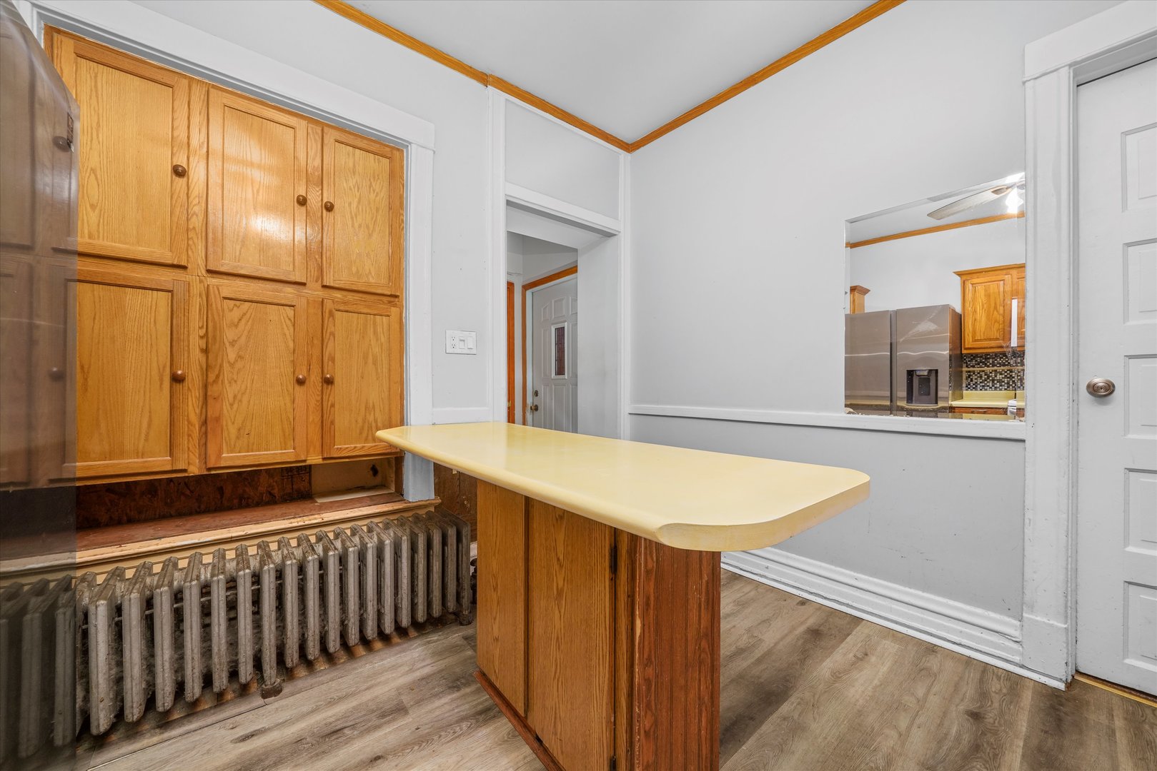 1450 North Springfield Avenue Chicago, IL 60651 - Photo 5 of 46 a view of a bedroom with wooden floor and a sink