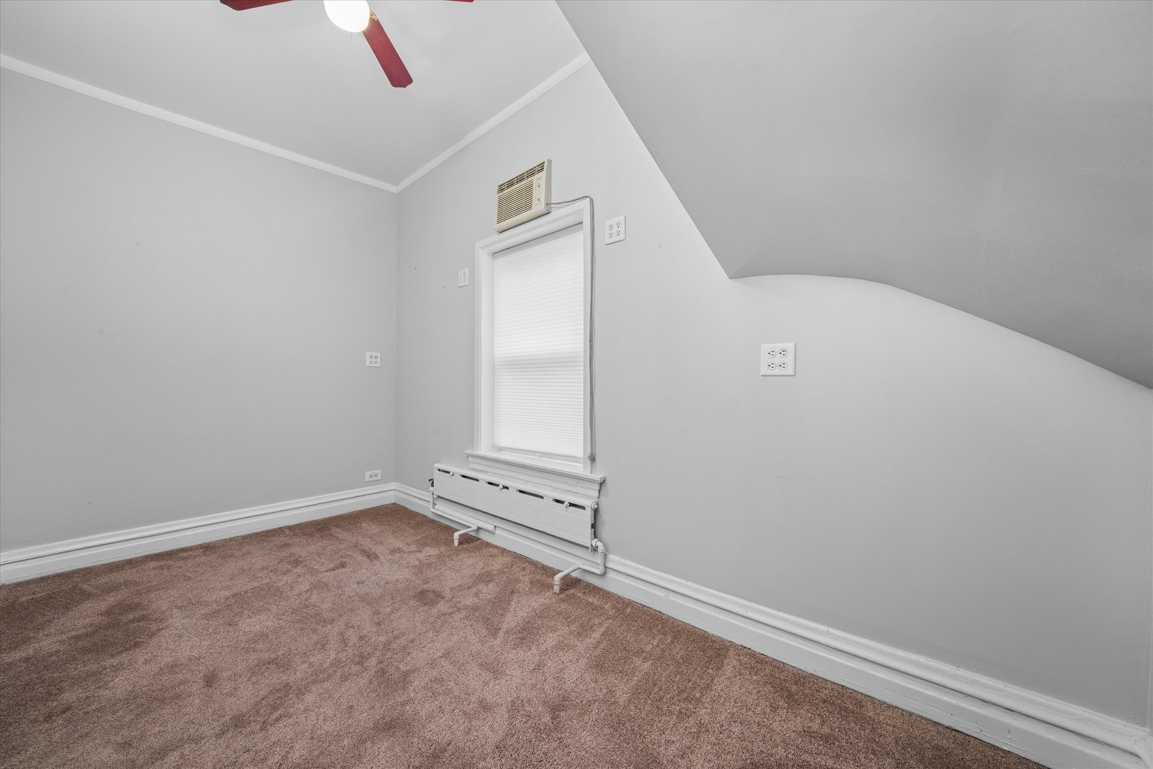 1450 North Springfield Avenue Chicago, IL 60651 - Photo 10 of 46 an empty room with white wall and window